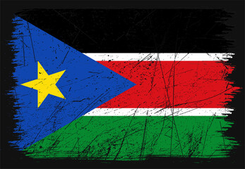Creative grunge flag of South Sudan country. Happy independence day of South Sudan. Brush flag on shiny black background