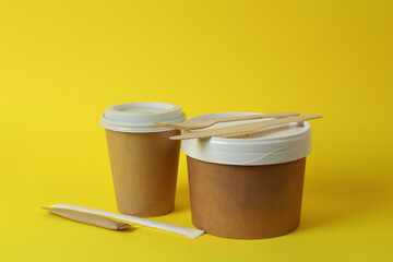 Delivery containers for takeaway food on yellow background