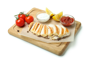 Board with grilled chicken meat isolated on white background