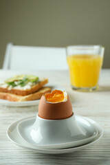 Concept of tasty breakfast with boiled egg, close up