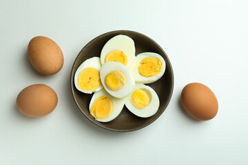 Boiled eggs on white background, top view