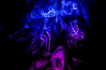 Colored smoke on black background