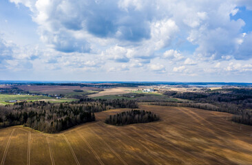 Aerial view of agricultural landscape with fields in spring season.