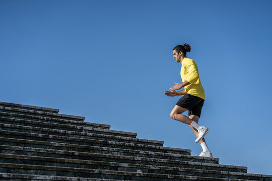 Athletic Men, Climbing Stairs To Strength Legs