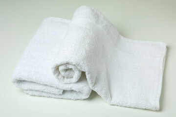 Fototapeta na wymiar Clean folded towels on white background, close up