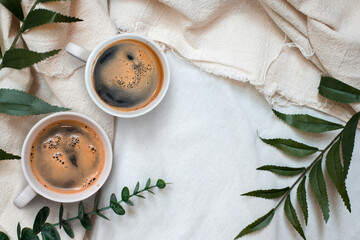 closeup black coffee cup put on linen fabric. top view