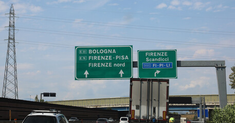 road signs at an italian  motorway junction with directions to reach Bologna Florence Pisa