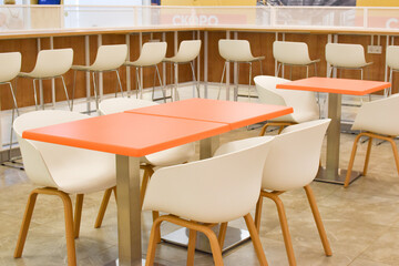 Interior of the cafe. Tables and chairs in the diner.