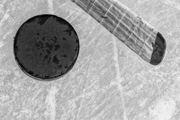 Hockey Stick and Puck on a Ice