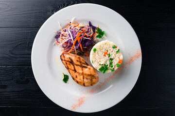 Steak chicken grill and cabbage lettuce coleslaw in a plate of us fat. Diet nutrition