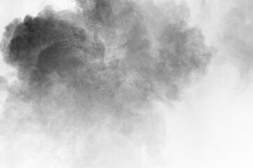 Black particles explosion isolated on white background.  Abstract dust overlay texture.