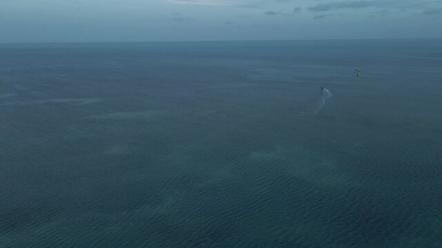 Cinematic footage of the kate surfer on the ocean 