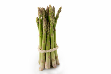 Raw fresh bunch of green asparagus isolated on white background