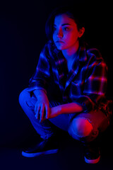 Portrait of teen with blue and red light