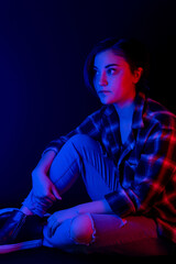 Portrait of teen with blue and red light