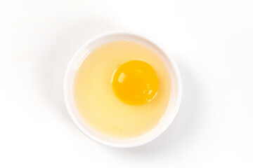 Raw egg yolk isolated on white background