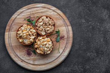 Roasted peanuts for beer, on a dark background