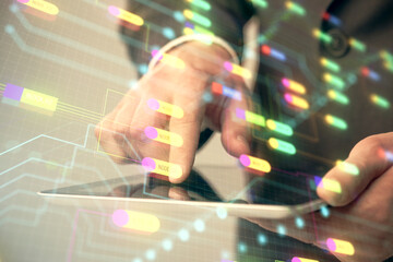 Multi exposure of man's hand holding and using a digital device and data theme drawing. Innovation concept.