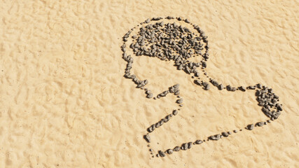 Concept conceptual stones on beach sand handmade symbol shape, golden sandy background, sign of human brain.  A 3d illustration metaphor for science, intelligence, anatomy, neurology, brainstorming