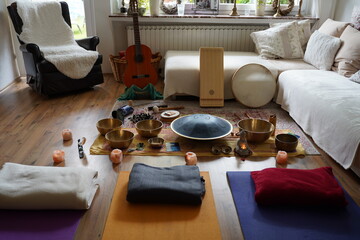 Sound healing set up with yoga mats and many instruments like RAV drum, monochord, guitar, tibetan...