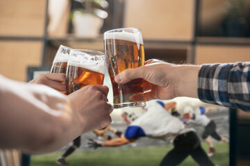 Group of friends watching sport match together. Concept of friendship, leisure activity, emotions