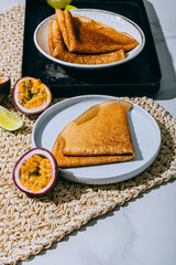 Crepes Or Thin Pancakes With Delicious passion fruit and lime.