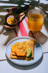Crepes Or Thin Pancakes With Delicious passion fruit and lime.