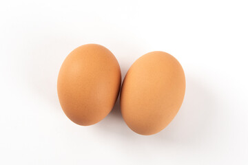 Raw brown chicken eggs on white background
