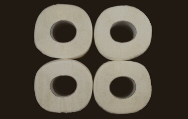 Four rolls of toilet paper. Top view. Toilet paper square