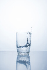 Alcoholic drink or water in a glass, splash, splash.