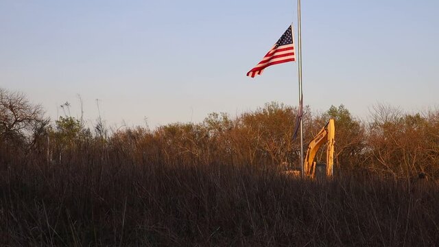 OLATHE, KS, UNITED STATES - May 02, 2021: American flag blowing in the wind at Ernie Miller Nature Center.
909 North, KS-7, Olathe, KS 66061