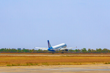 Passenger plane takes off from runway in airport