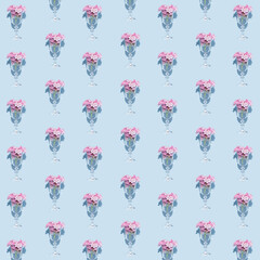 Minimalistic retro concept with pink blossoming flowers in a glass on pastel blue background. Modern summer arrangement, colorful floral arrangement with a shadow.