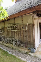 Fotobehang 日本の古い茅葺きの家のクローズアップ © masamasa3