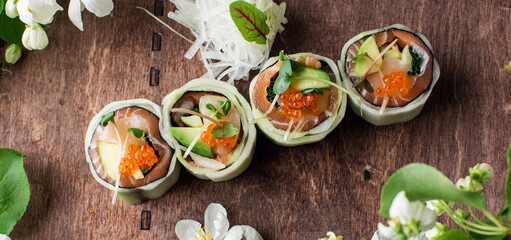 healthy kale and avocado sushi roll with chopsticks