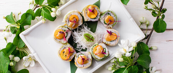 healthy kale and avocado sushi roll with chopsticks