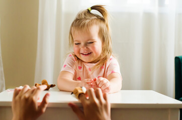 Child playing theater with animal finger puppets. Role-playing games and activities for expressing...