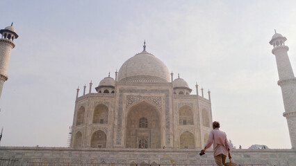 Taj Mahal ivory-white marble mausoleum on the south bank of Yamuna river in Agra, India