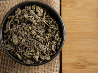 Green tea on burlap close up
