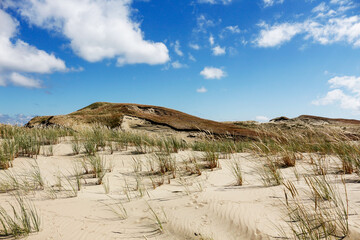 Beautiful landscape with sand dunes and cloudy skies. Summer day on the Curonian Spit, Lithuania