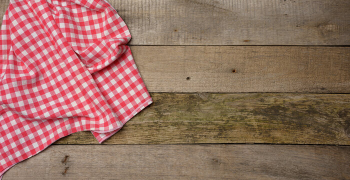 red kitchen towel on gray wooden background