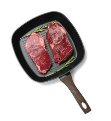 two raw pieces of beef in a black square grill pan, steaks isolated on white background