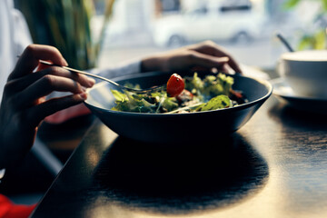 delicious food in a plate restaurant cafe a cup of coffee in the background red tomato fork