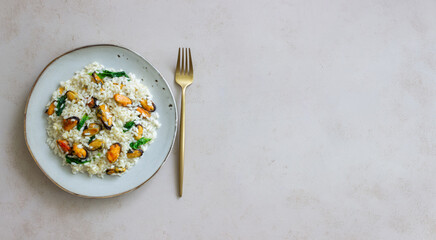 Risotto with mussels and spinach. Healthy food. Vegetarian food.