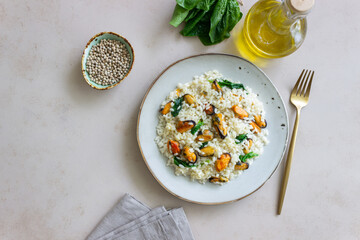 Risotto with mussels and spinach. Healthy food. Vegetarian food.