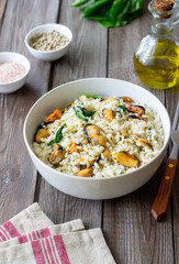 Risotto with mussels and spinach. Healthy food. Vegetarian food.