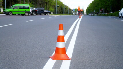 Traffic cone,orange. Traffic cone in the road.