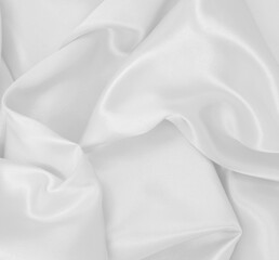 Smooth elegant white silk or satin luxury cloth texture as wedding background. Luxurious background design