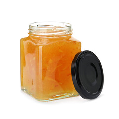 Delicious orange marmalade in jar on white background