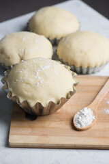 four molds with air dough with cakes